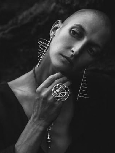 Model wearing silver jewelry
